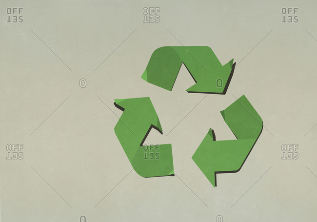 Green recycling symbol on brown background