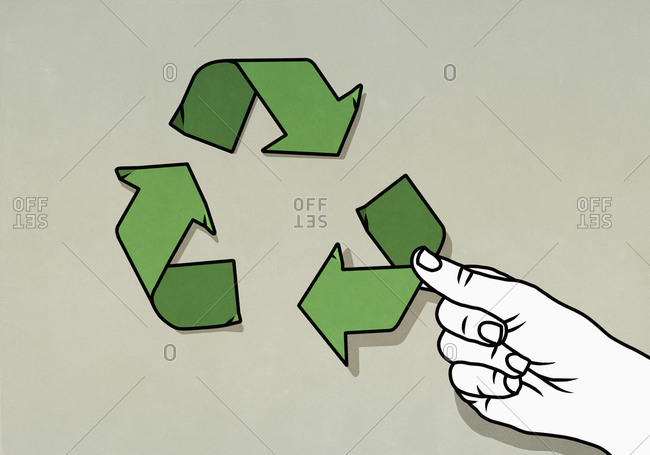 Hand arranging green recycling arrow symbol