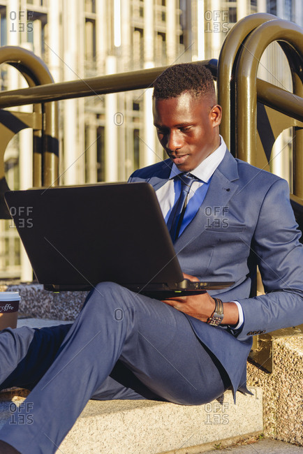 Full body side view of concentrated african american financial manager