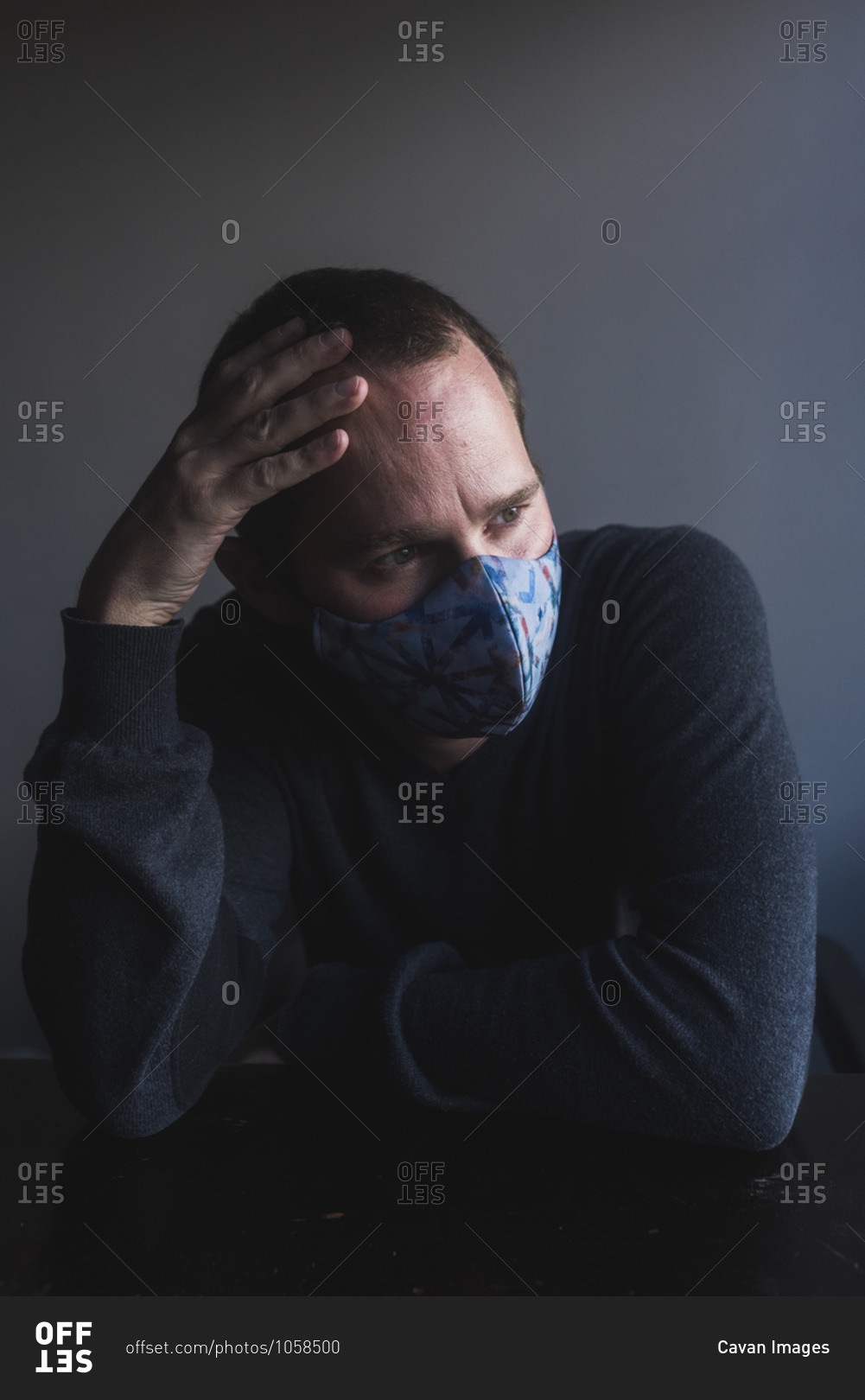 Portrait of white man worried about pandemic and using mouth cover