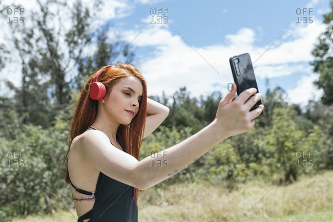 Cute red hair girl making a selfie