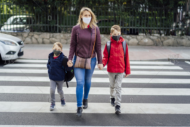 children crossing the pedestrian crossing. teaching children