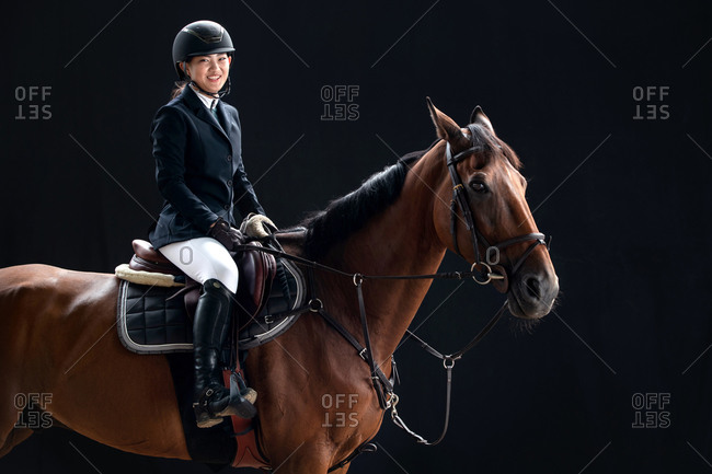 Happy youth portrait on horseback
