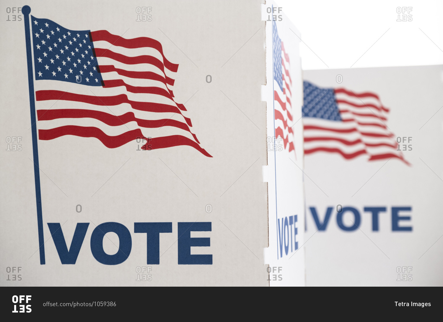 Voting booth with US flag stock photo - OFFSET