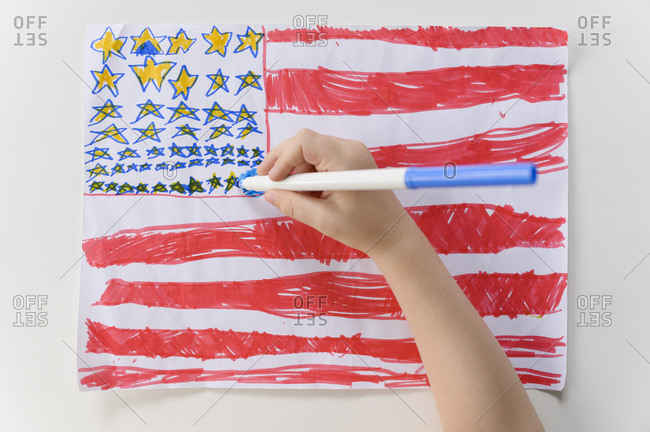 Boys (4-5) hand drawing US flag
