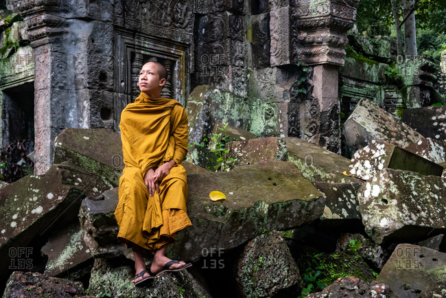 TA PROHM, ANGKORIAN TEMPLE, SIEM REAP, CAMBODIA - 28 October 2014: Monks appreciate temple environment.