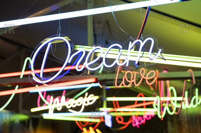 Colorful neon signs glowing indoors
