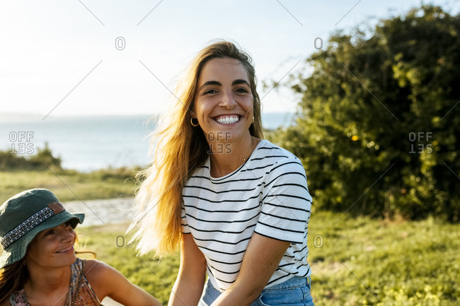 Cheerful young woman enjoying weekend with sister