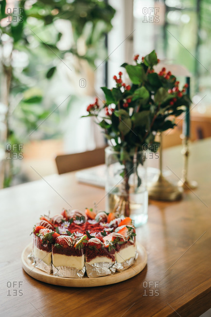 Red Velvet Cake on wooden table in rustic cafe