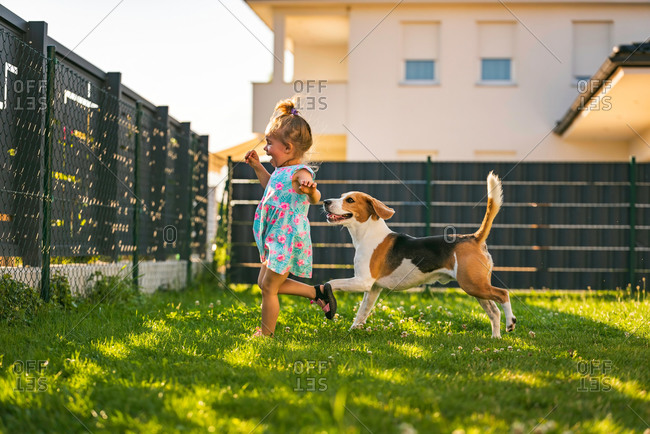 Kids Boy and Girl Playing in The Garden with Animals on Summer