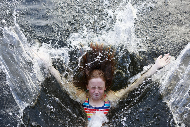 Girl splashing into sea from the Offset collection