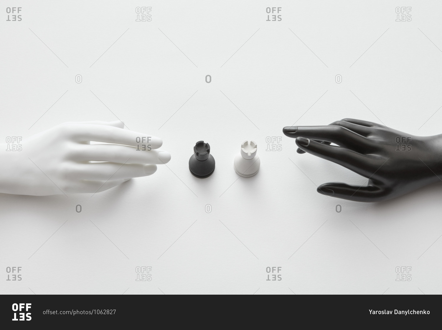 Plastic doll hands with white and black rooks figures.