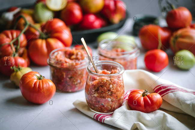 Homemade salsa in glass jars made from homegrown tomatoes