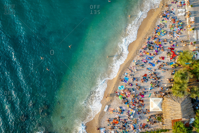 September 12, 2019 - Komiza, Croatia: Aerial view of tourists at Kod Senke Hotel on Komiza beach