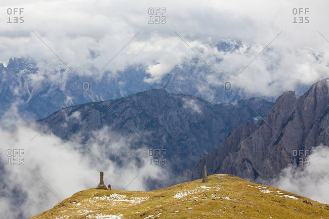 Walkers and monuments, Trentino-Alto Adige, South Tyrol in Bolzano district, Alta Pusteria, Hochpustertal, Sexten Dolomites, Italy