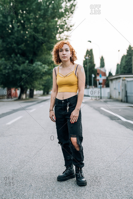 Portrait of young woman standing in street