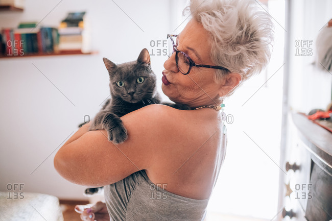 Woman holding her pet cat