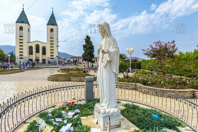 August 20, 2017: Saint James church in Medjugorje and the statue of the Virgin Mary, municipality of Citluk, Bosnia and Herzegovina