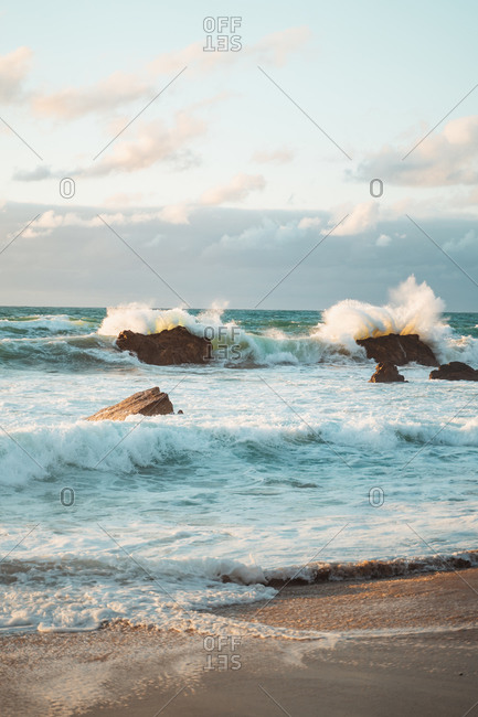 Big waves crashing against the rocks in the coast