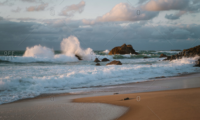 Big waves crashing against the rocks on the coast of Biarritz, France