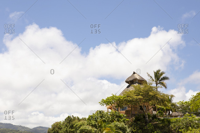 Hilltop building surrounded by dense foliage in Sayulita, Nayarit, Mexico
