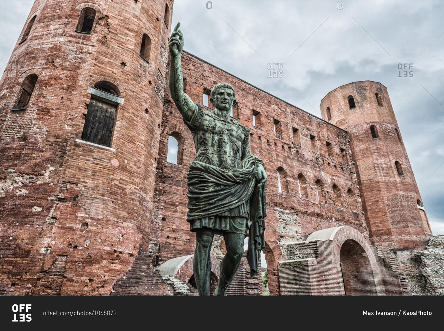 Italy, Piemonte (Piedmont), Torino (Turin) . View of Porta Palatina (Palatine Gate), on the foreground the bronze replica statue of the Roman Emperor Augustus Caesar
