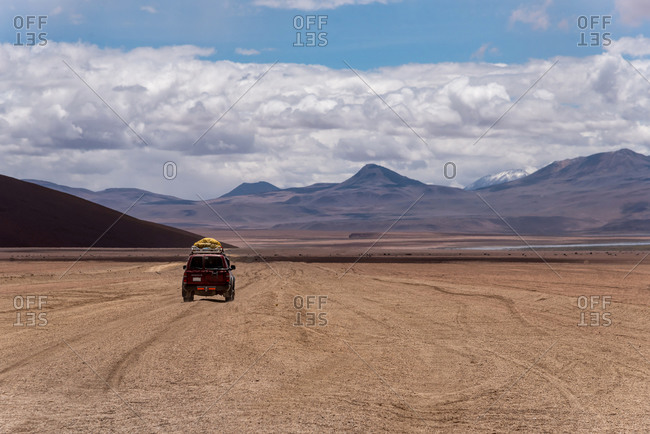 A 4x4 driving through the southwest of the altiplano in Bolivia