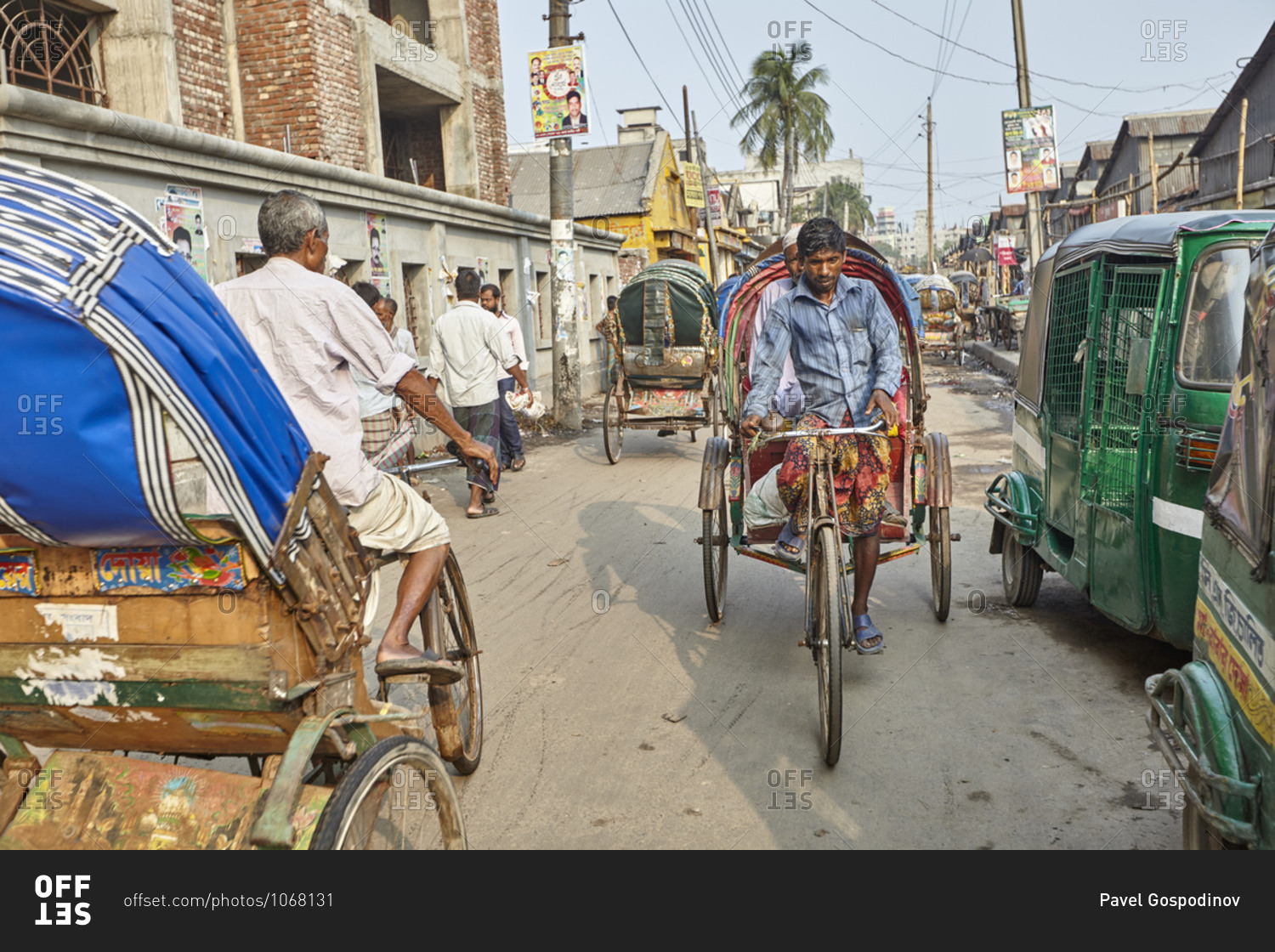 Dhaka, Bangladesh - April 27, 2013: Many rickshaw drivers working on ...