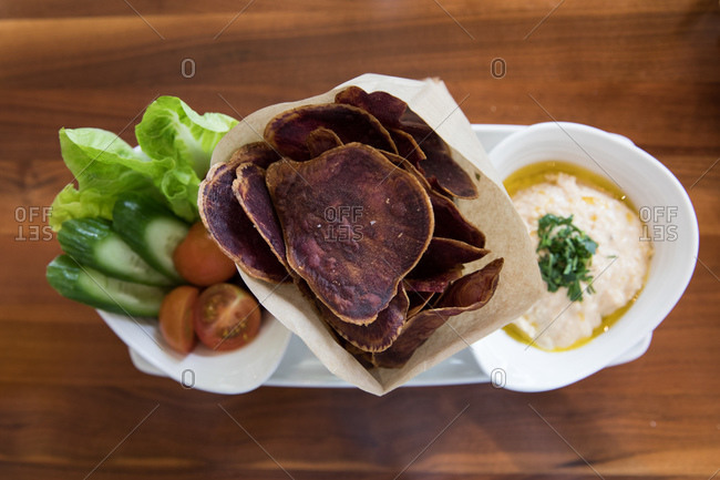 Overhead view of a crudite platter with taro chips