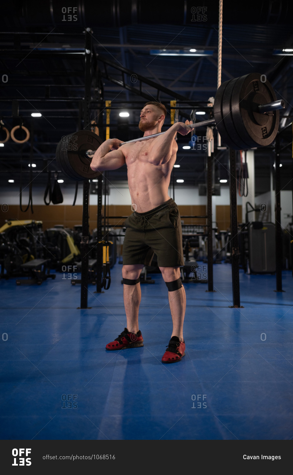 Sportsman doing clean and jerk exercise