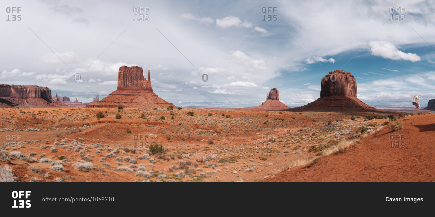 Panoramic view of monument valley with American flag