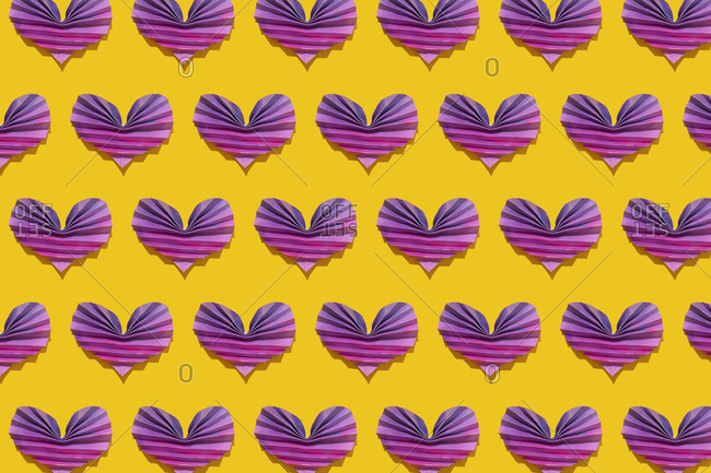 Pattern of pink and purple origami hearts