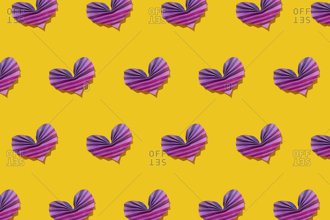 Pattern of pink and purple origami hearts