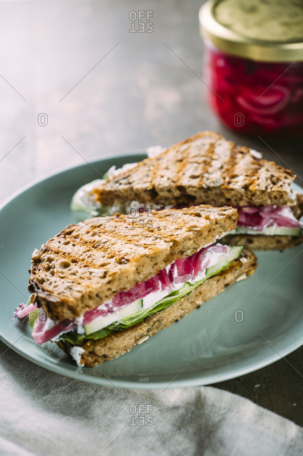 Grilled sandwiches with cucumbers- creamed goat cheese and pickled onions