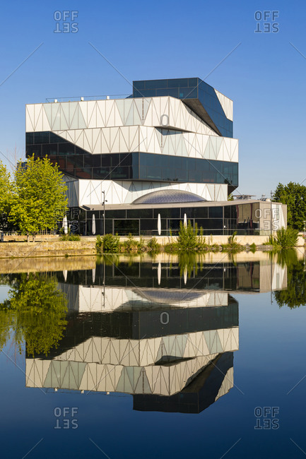 May 19, 2020: Germany- Baden-Wurttemberg- Heilbronn- Experimental science center reflecting in river Neckar