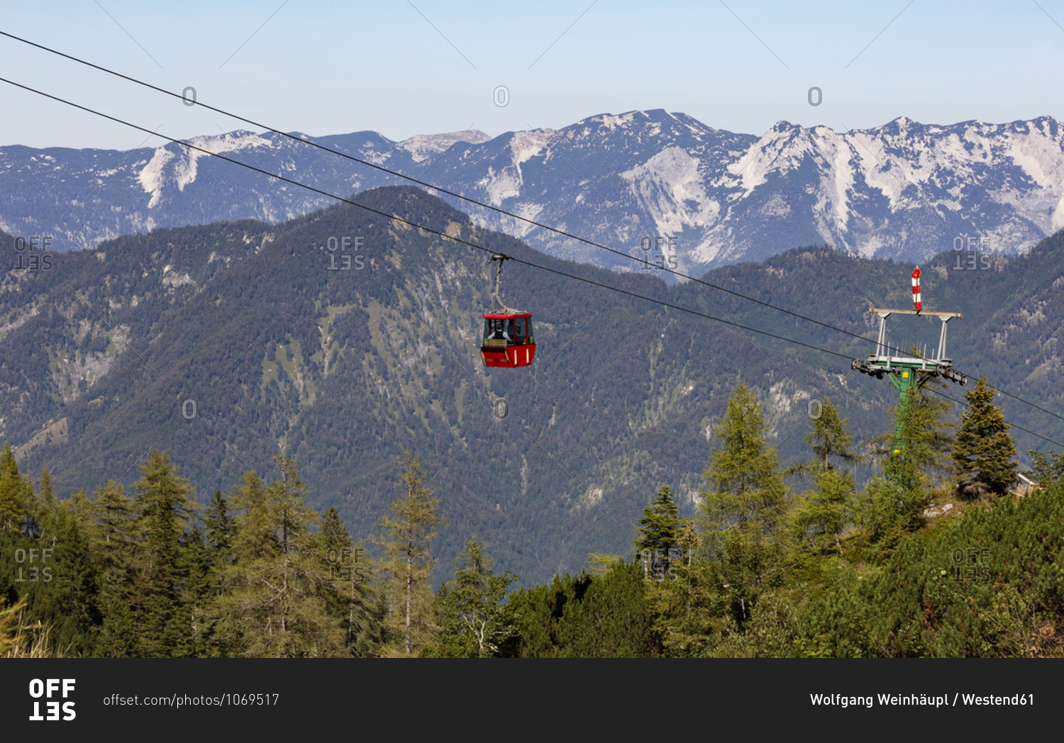Austria- Upper Austria- Bad Ischl- Overhead cable car moving over forested mountain valley