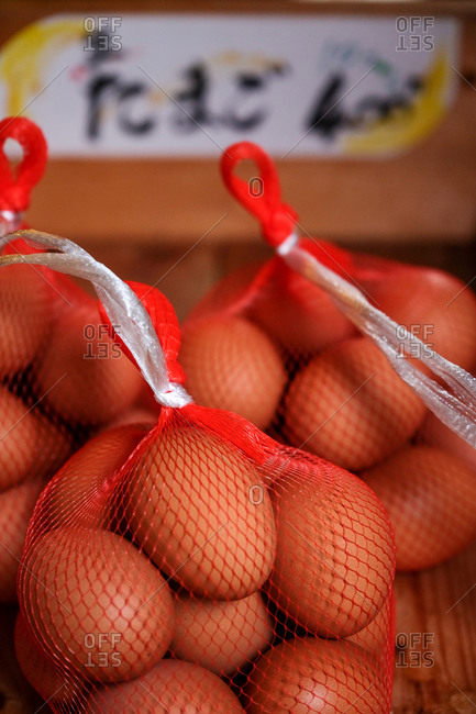 Mesh bags filled with eggs for making onsen tamago traditional Japanese low temperature eggs
