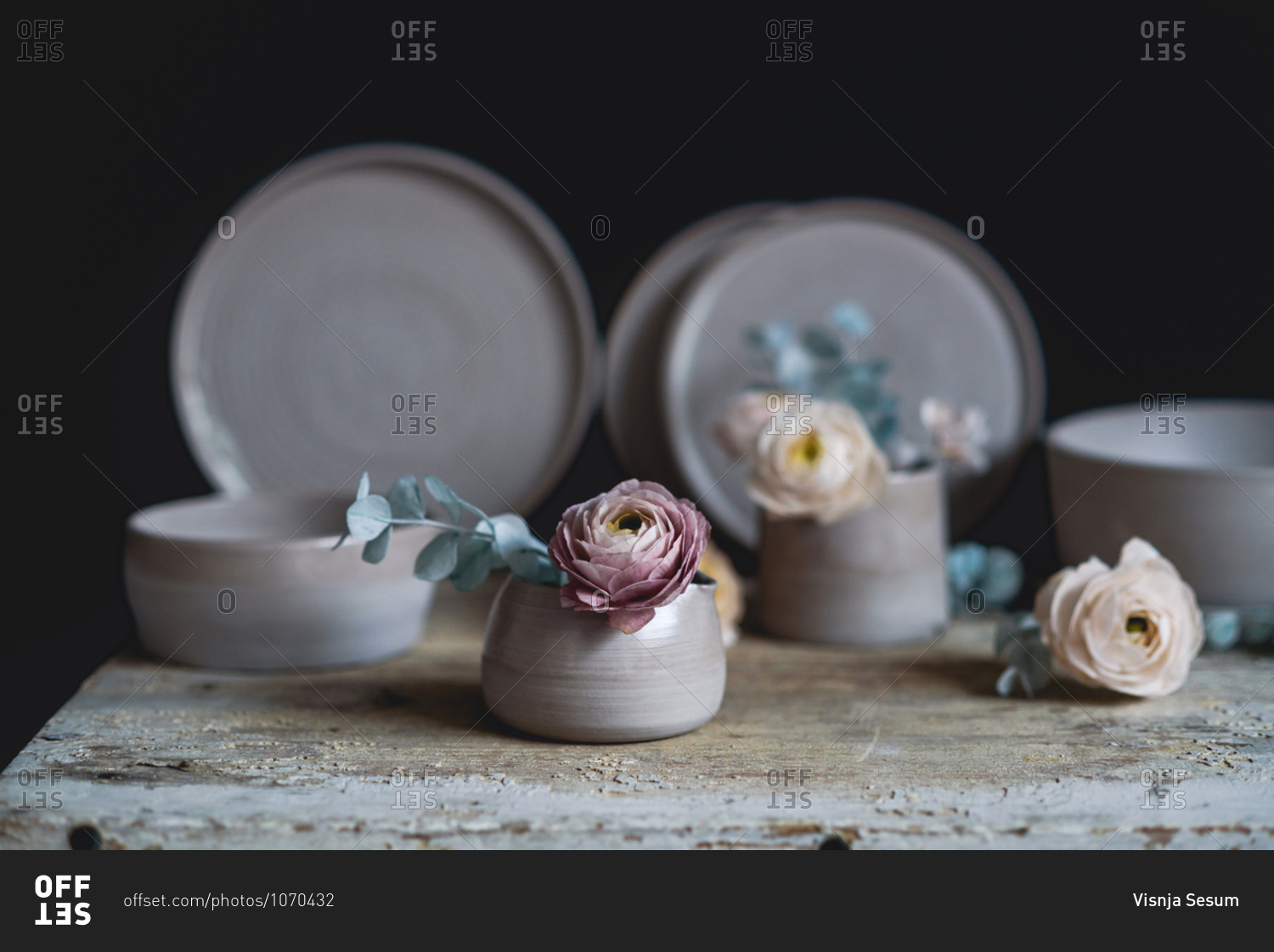 Handmade ceramic cup with flowers inside