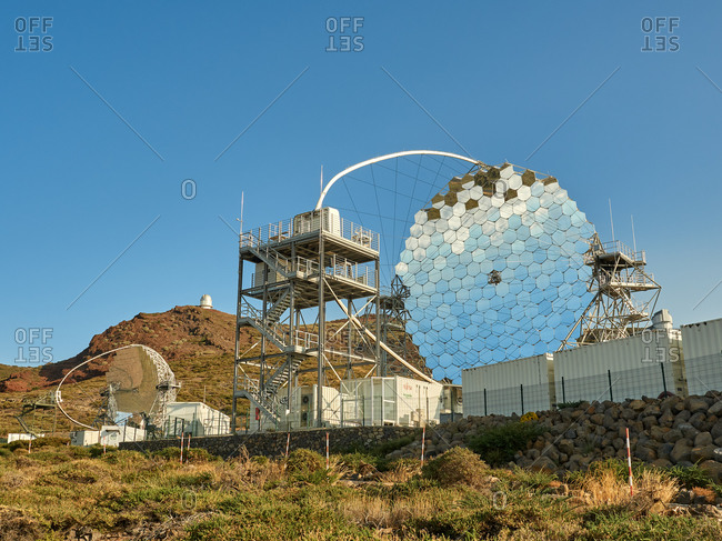 October 13, 2020: Various modern telescopes including MAGIC or Major Atmospheric Gamma Imaging Cherenkov Telescope located on hill slope at astronomical observatory on island of La Palma in Spain
