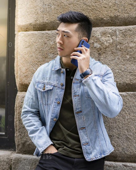 Serious young Asian male in casual 