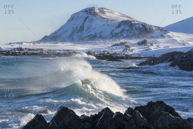 Waves of cold Barents Sea rising up before breaking on rocks, Sandfjorden, Arctic Ocean, Varanger Peninsula, Finnmark, Norway, Scandinavia, Europe