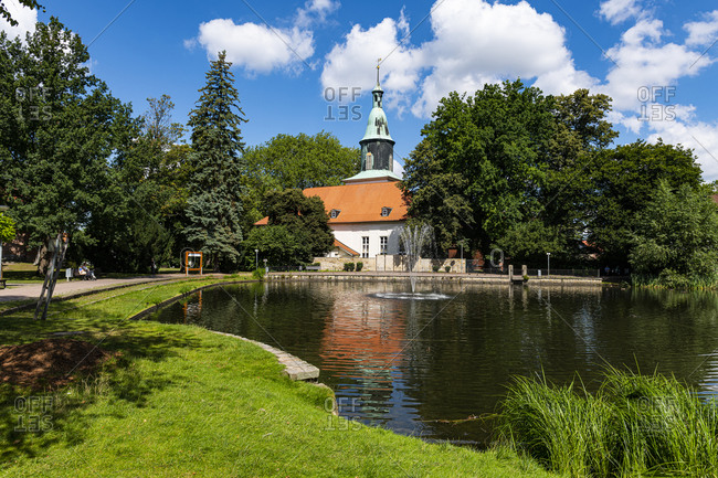 Pond in front of the Michaelis Church in Fallersleben, Wolfsburg, Lower Saxony, Germany, Europe