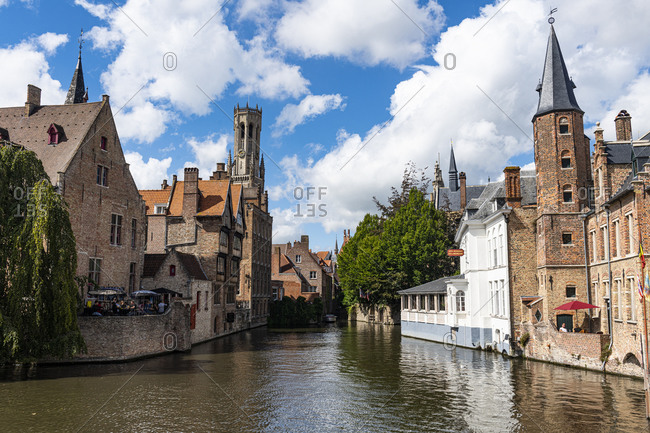 August 23, 2020: Rozenhoedkaai with the belfry, Bruges, UNESCO World Heritage Site, Belgium, Europe