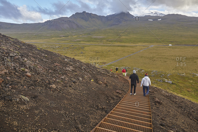 September 21, 2015: Exploring a volcanic landscape on a footpath up Saxholl cinder cone and crater, Snaefellsjokull National Park, western Iceland, Polar Regions