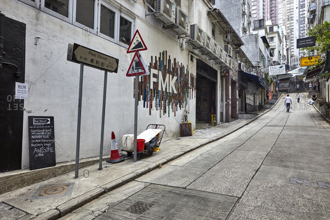 Hong Kong, China - September 23, 2016: A narrow street with old buildings in the Central part of Hong Kong