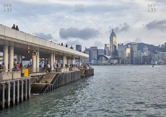 Hong Kong, China - September 23, 2016: One of the 7 Central piers with Hong Kong skyline visible at the Central Ferry Piers