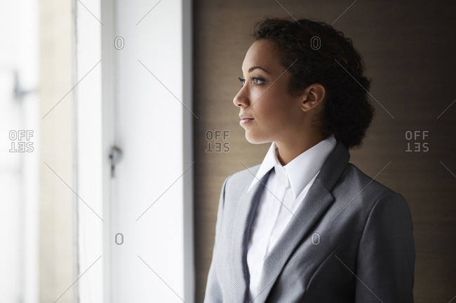 Portrait of businesswoman looking out of window