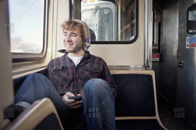 Young man on train in Chicago, Illinois