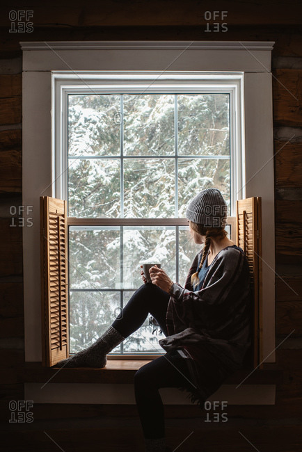 Woman looking out of window