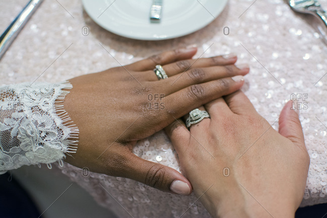 Premium Photo | Close-up of couple holding hands with engagement ring